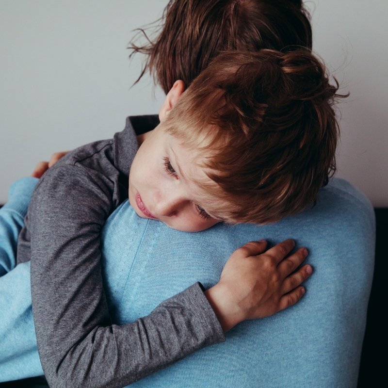 child hugging parent